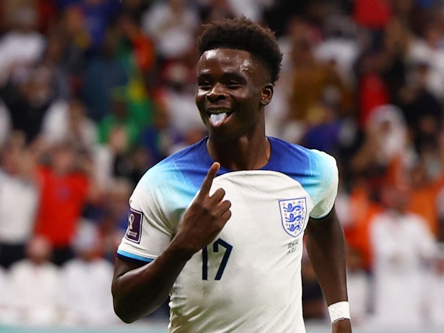 Bukayo Saka celebrates scoring for England on December 4, 2022