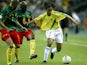 Brazil's Ronaldinho in action with Cameroon's Geremi at the Confederations Cup on June 19, 2003
