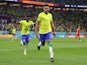 Brazil's Casemiro celebrates scoring their first goal with Vinicius Junior on November 28, 2022