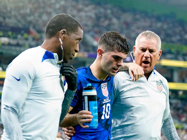 Christian Pulisic leaves the field injured during the USA's World Cup clash with Iran on November 29, 2022