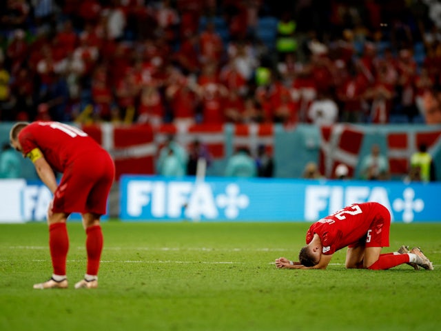 Denmark players look dejected following their elimination from the World Cup on November 30, 2022