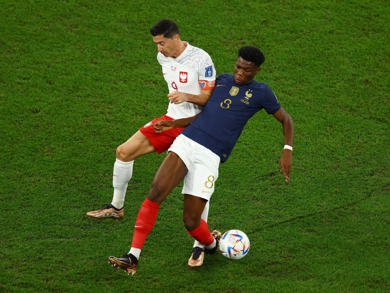 Poland's Robert Lewandowski In Action With France's Aurelien Tchouameni ...