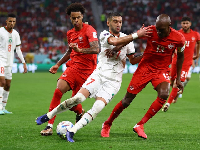 Morocco's Hakim Ziyech in action with Canada's Atiba Hutchinson on December 1, 2022
