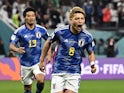 Japan's Ritsu Doan celebrates scoring against Spain at the World Cup on December 1, 2022