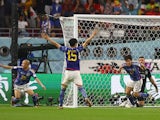 Japan's Ao Tanaka celebrates scoring against Spain at the World Cup on December 1, 2022