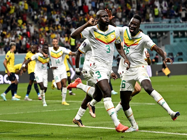 Kalidou Koulibaly celebrates scoring their second goal with Senegal teammates on November 23, 2022