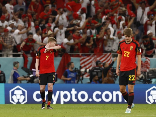 Belgium's Kevin De Bruyne and Charles De Ketelaere look dejected after Morocco's second goal on November 27, 2022