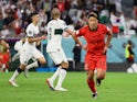 South Korea's Hwang Hee-chan celebrates scoring against Portugal at the World Cup on December 2, 2022