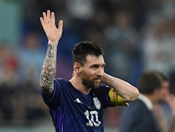 Argentina's Lionel Messi celebrates after the match on November 30, 2022