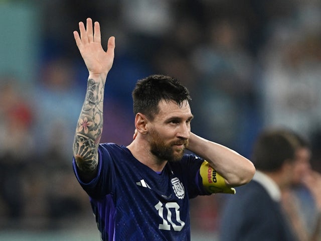 Argentina's Lionel Messi celebrates after the match on November 30, 2022