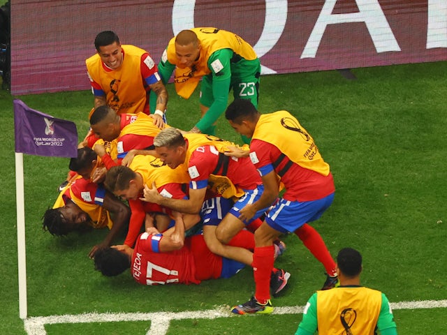 Costa Rica's Yeltsin Tejeda celebrates scoring against Germany with teammates on December 1, 2022