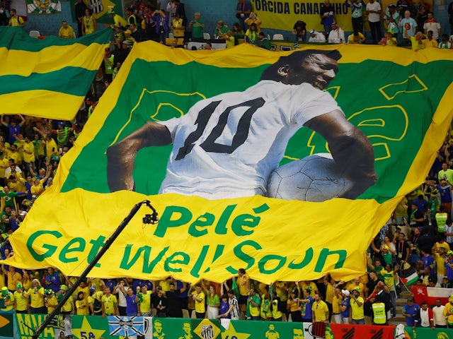 Brazil fans display a banner with an image of former player Pele on it before the match on December 2, 2022