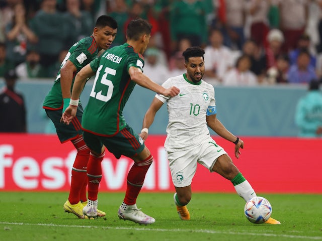  Saudi Arabia's Salem Al-Dawsari in action with Mexico's Hector Moreno on November 30, 2022