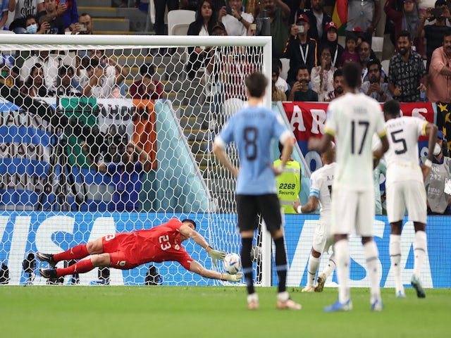 Uruguay's Sergio Rochet saves a penalty from Ghana's Andre Ayew on November 23, 2022