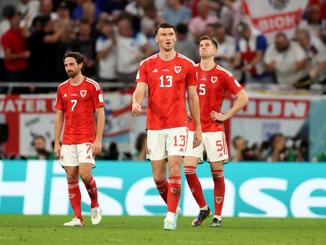 Wales players look dejected after Marcus Rashford scores for England on November 29, 2022