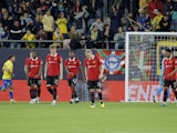 Manchester United players react to conceding a goal against Cadiz in a mid-season friendly on December 7, 2022
