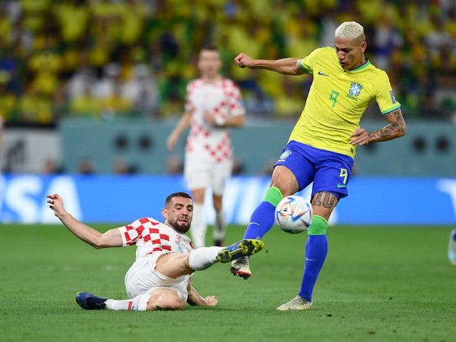 Croatia's Mateo Kovacic in action with Brazil's Richarlison at the World Cup on December 9, 2022