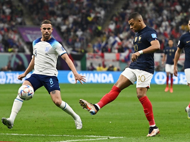 England's Jordan Henderson in action with France's Kylian Mbappe at the World Cup on December 10, 2022