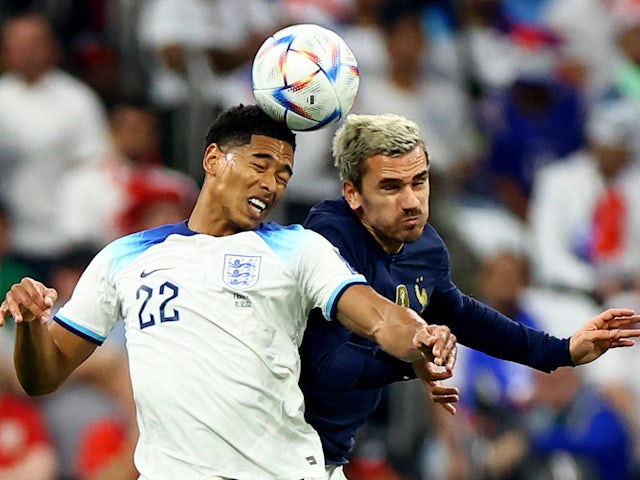 England's Jude Bellingham in action with France's Antoine Griezmann at the World Cup on December 10, 2022