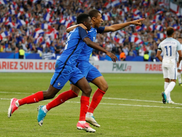 Ousmane Dembele celebrates scoring for France against England in June 2017