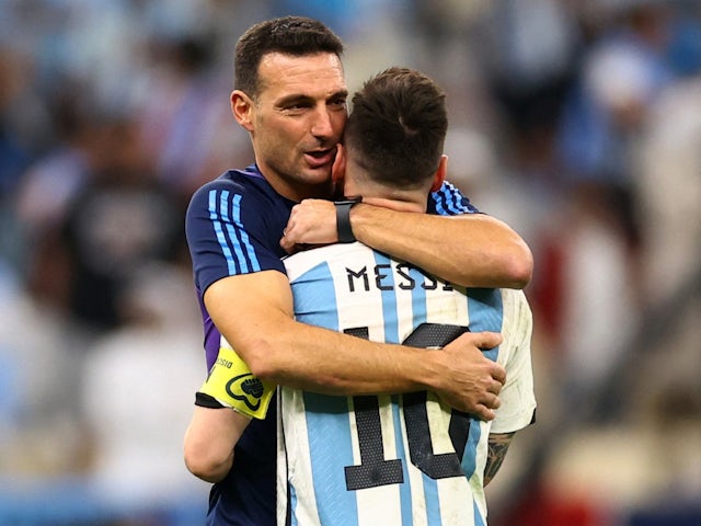 Argentina's Lionel Messi and head coach Lionel Scaloni celebrate qualifying for the semi-finals on December 9, 2022