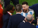 Argentina's Lionel Messi with Netherlands coach Louis van Gaal and assistant coach Edgar Davids on December 9, 2022