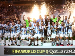 Scaloni and nine Argentina players react after winning World Cup