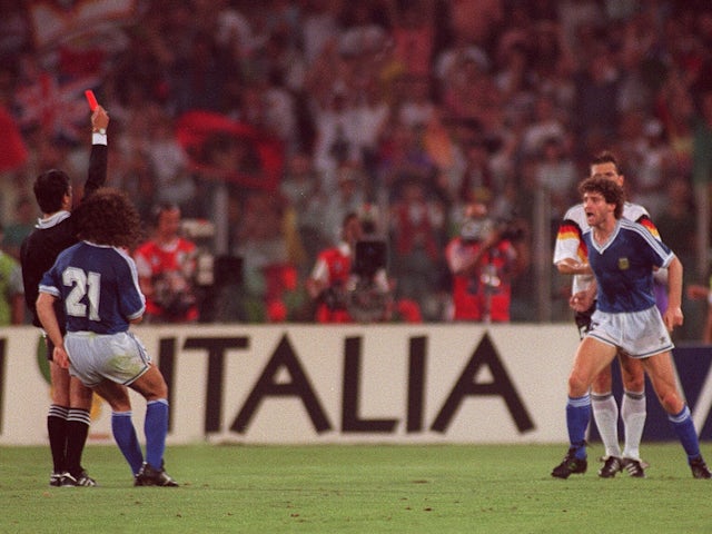 Referee sends off Argentina's Pedro Troglio by giving him a red card in the 1990 World Cup final