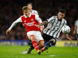Arsenal's Martin Odegaard in action with Juventus' Enzo Barrenechea on December 17, 2022