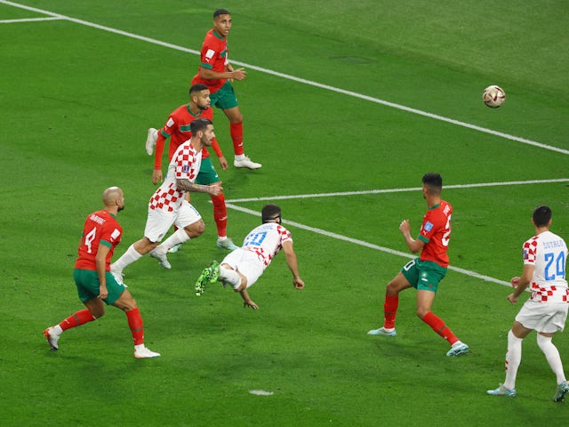 Croatia's Josko Gvardiol scores their first goal on December 17, 2022