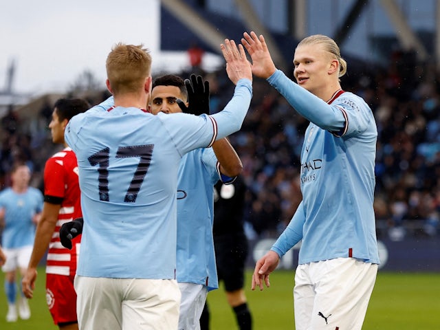 Manchester City's Erling Braut Haaland celebrates scoring their second goal with Kevin De Bruyne and Riyad Mahrez on December 17, 2022