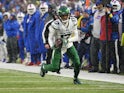 New York Jets wide receiver Garrett Wilson (17) runs with the ball after making a catch against the Buffalo Bills during the second half at Highmark Stadium on December 11, 2022