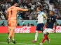 France's Hugo Lloris reacts after England's Harry Kane misses a penalty on December 10, 2022