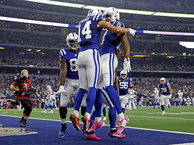 Indianapolis Colts wide receiver Alec Pierce (14) celebrates with Indianapolis Colts wide receiver Mike Strachan (17) after catching a touchdown pass during the second half against the Dallas Cowboys at AT&T Stadium on December 5, 2022