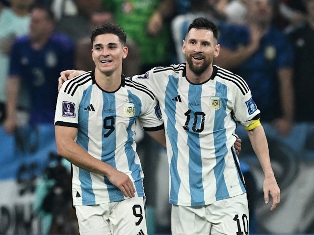 Argentina's Julian Alvarez celebrates scoring their third goal with Lionel Messi on December 13, 2022