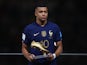 France's Kylian Mbappe poses with his Golden Boot award during the award ceremony after the match on December 18, 2022