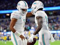 Miami Dolphins wide receiver Tyreek Hill (10) celebrates his touchdown scored against the Los Angeles Chargers with quarterback Tua Tagovailoa (1) during the first half at SoFi Stadium on December 11, 2022