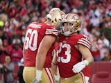 San Francisco 49ers running back Christian McCaffrey (23) is congratulated by offensive tackle Daniel Brunskill (60) after scoring a touchdown against the Tampa Bay Buccaneers in the third quarter at Levi's Stadium on December 11, 2022