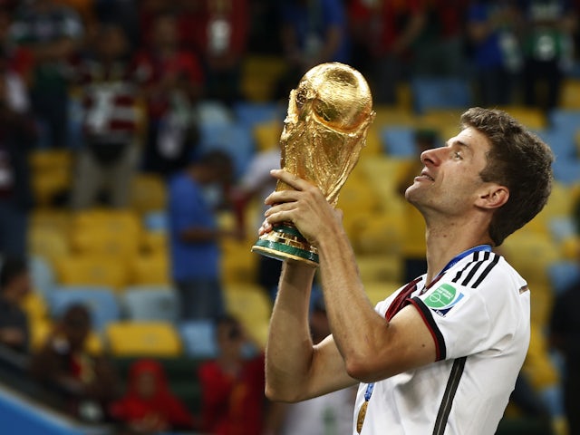 Germany's Thomas Muller lifts the World Cup trophy in 2014