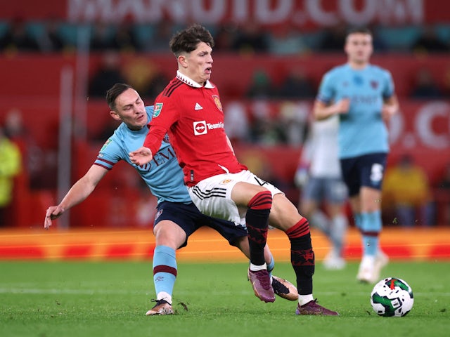 Manchester United's Alejandro Garnacho in action with Burnley's Connor Roberts in the EFL Cup on December 21, 2022