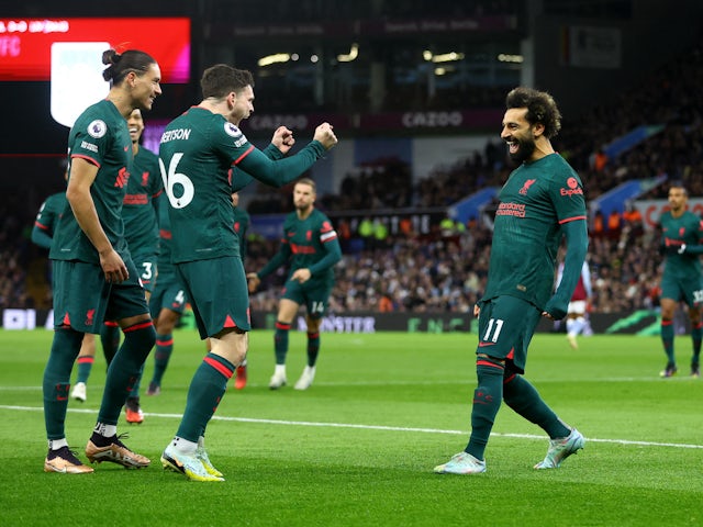 Liverpool's Mohamed Salah celebrates scoring their first goal with teammates on December 26, 2022