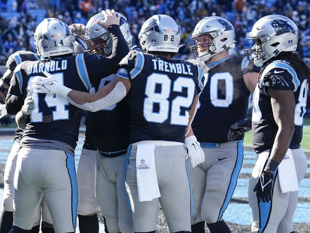 Carolina Panthers quarterback Sam Darnold (14) celebrates his running touchdown with teammates during the second quarter against the Detroit Lions at Bank of America Stadium on December 24, 2022