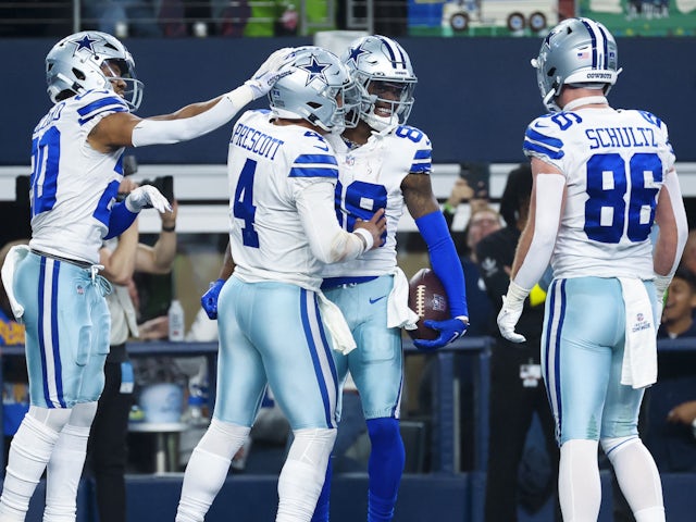 Dallas Cowboys wide receiver CeeDee Lamb (88) celebrates with teammates after scoring a touchdown during the second half against the Philadelphia Eagles at AT&T Stadium on December 24, 2022