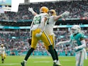 Green Bay Packers tight end Marcedes Lewis (89) celebrates his touchdown against the Miami Dolphins with tight end Josiah Deguara (81) during the first half at Hard Rock Stadium on December 25, 2022