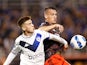 Velez Sarsfield's Maximo Perrone in action with River Plate's Braian Romero on June 29, 2022