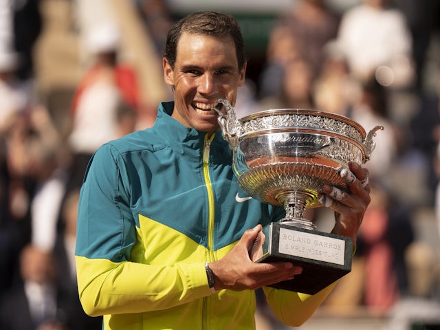 Rafael Nadal (ESP) bites the trophy after winning the men's singles final against Casper Ruud (NOR) on day 15 of the French Open at Stade Roland-Garros on June 5, 2022