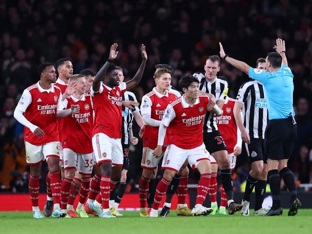 Players from Arsenal and Newcastle United remonstrate with referee Andrew Madley on January 3, 2022