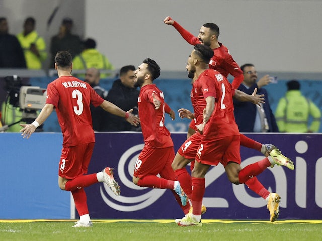 Bahrain's Kamil Al Aswad celebrates scoring their first goal with teammates on January 7, 2023