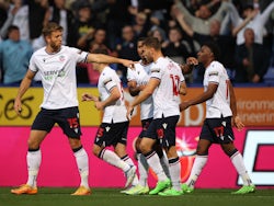 Bolton Wanderers' Dion Charles celebrates scoring their first goal with teammates on August 23, 2022