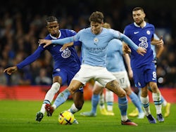 Chelsea's Carney Chukwuemeka in action with Manchester City's John Stones on January 5, 2023